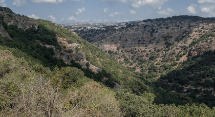 Fototapeta na wymiar View of Western Galilee mountains as seen from the scenic trail to Ein Tamir Spring, Montfort Nahal Kziv National park, Northern District of Israel, Israel. 
