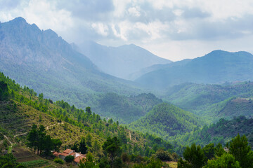 High mountains with mist and different layers that are lost in the horizon.