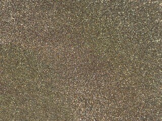 Golden shiny background. magical shimmer festive glittering shiny golden sparkles.