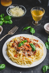 Spaghetti with bolognese sauce, parmesan and basil