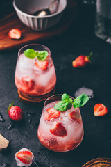 Cocktail with strawberry, gin and sparkling water