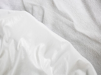 White texture close-up of material for making waterproof mattress covers. Protection of the bed...