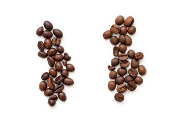 Two heaps of coffee grain Robusta and Arabica. Top view of roasted cofee beans robusta or Coffea...