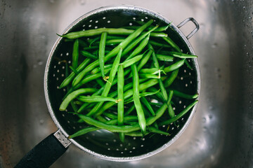 Washing vegetables in colander
