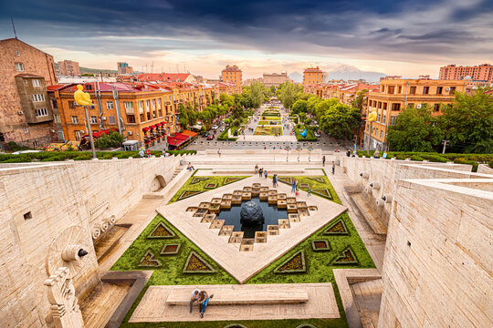 24 May 2021, Yerevan, Armenia: Scenic view from the stairs of Cascade monument to the colorful sunset over roofs of Yerevan city and symbol of Armenia - Mount Ararat