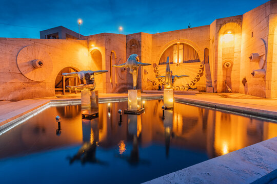24 May 2021, Yerevan, Armenia: The sculpture Divers depicts swimmers diving into a pool or fountain on the terrace of the Cascade monument in Yerevan