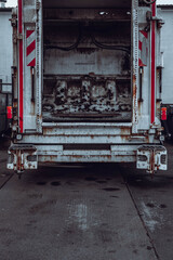 Vertical photo of a truck from the back with an open trunk