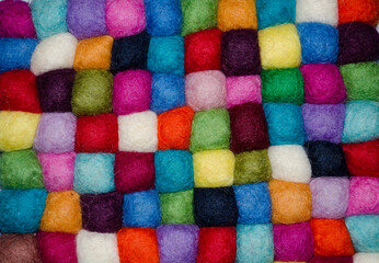 Multicolored background made of felt pieces.