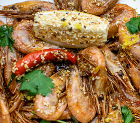 oysters in cream sauce.decorated with black caviar and greens