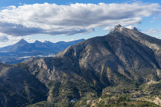 clouds sky and mediterranean Bernia mountain ridge travel and hiking in Spain