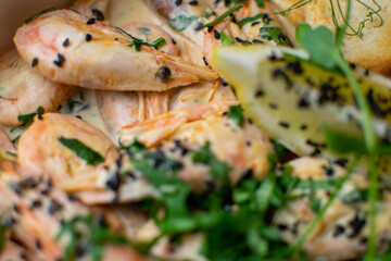 oysters in cream sauce.decorated with black caviar and greens