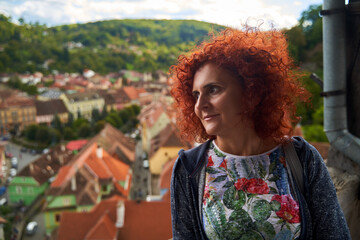 Woman with old town in background
