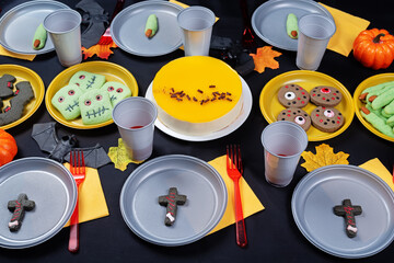 Halloween sweet appetizer kids table setting concept