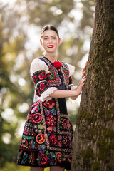 Young beautiful slovak woman in traditional dress. Slovak folklore