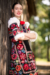 Young beautiful slovak woman in traditional dress. Slovak folklore