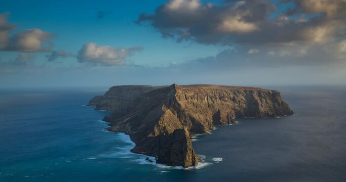 Ilheu da Cal, a small island next to Porto Santo, as seen from Ponta da Calheta viewpoint. Madeira, Portugal. Time-lapse
