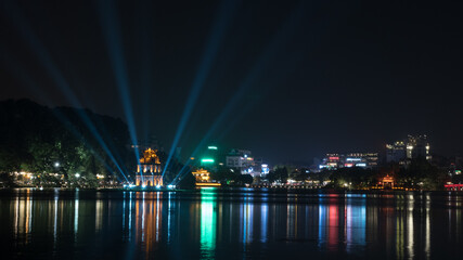 Fototapeta na wymiar Turtle Tower at Hoan Kiem Lake in night Hanoi, Vietnam