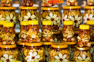 jars of homemade honey on the store counter for sale. the concept of healthy eco-friendly food