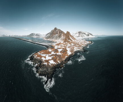 Drone view of a snow covered Eystrahorn mountain in Iceland at Hvalnes peninsula