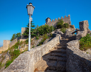 Fototapeta na wymiar San Marino. Old stone towers on top of the mountain.