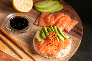Puffed rice spread with raw salmon and avocado