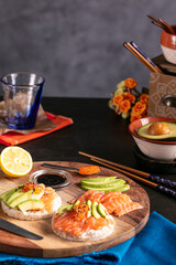 Fototapeta na wymiar Puffed rice spread with raw salmon and avocado