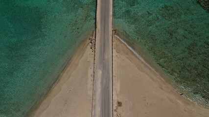 Aerial drone photo of main port of Kythera island and turquoise exotic beach of Diakofti, Ionian, Greece