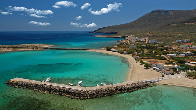 Aerial drone photo of main port of Kythera island and turquoise exotic beach of Diakofti, Ionian, Greece