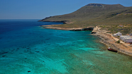 Aerial drone photo of main port of Kythera island and turquoise exotic beach of Diakofti, Ionian, Greece