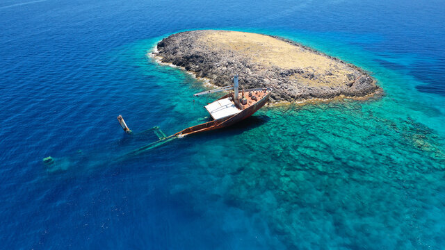 Aerial drone photo of famous shipwreck of "Nordland" half sunk ship in islet of Prasonisi near Diakofti main port of Kithira island, Ionian, Greece