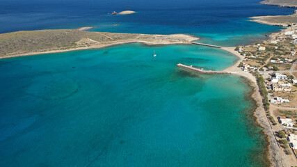 Fototapeta na wymiar Aerial drone photo of main port of Kythera island and turquoise exotic beach of Diakofti, Ionian, Greece