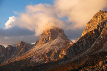 Famous Passo di Giau, Monte Gusela at behind Nuvolau gruppe the Dolomites mountains, near the famous Cortina d’Ampezzo city at sunset in South Tyrol