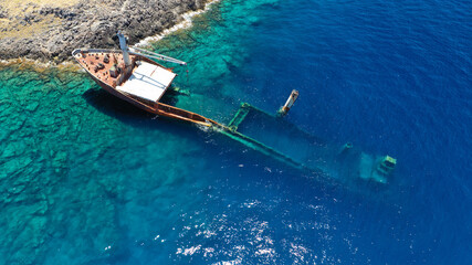 Aerial drone photo of famous shipwreck of "Nordland" half sunk ship in islet of Prasonisi near Diakofti main port of Kithira island, Ionian, Greece
