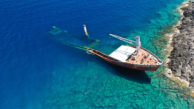 Aerial drone photo of famous shipwreck of "Nordland" half sunk ship in islet of Prasonisi near Diakofti main port of Kithira island, Ionian, Greece