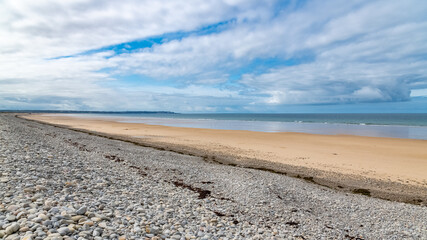 Beautiful beach at Vauville in Normandy, with pebbles
