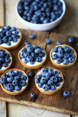 Blueberry tartlets. Delicious dessert with berries. Healthy snack.