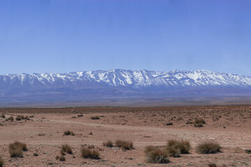 Africa Morocco desert Atlas mountains nature rock landscape with river palm under blue sky hot weather 