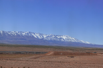 Africa Morocco desert Atlas mountains nature rock landscape with river palm under blue sky hot weather 