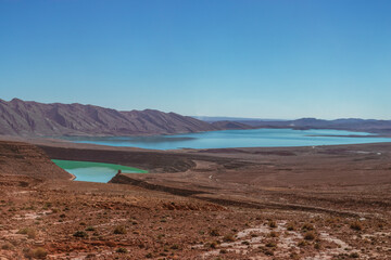 Africa Morocco desert Atlas mountains nature rock landscape with river palm under blue sky hot weather 