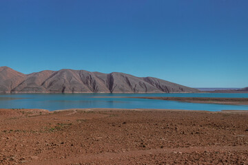 Africa Morocco desert Atlas mountains nature rock landscape with river palm under blue sky hot weather 