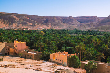 Africa Morocco desert Atlas mountains nature rock landscape with river palm under blue sky hot weather 
