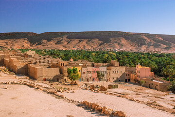 Africa Morocco desert Atlas mountains nature rock landscape with river palm under blue sky hot weather 