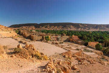 Africa Morocco desert Atlas mountains nature rock landscape with river palm under blue sky hot weather 