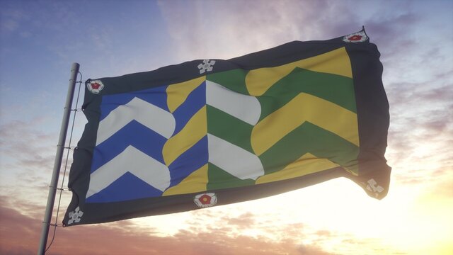 Cumbria flag, England, waving in the wind, sky and sun background. 3d rendering