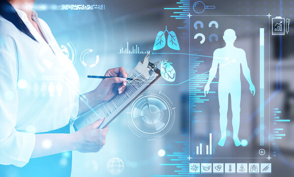 Female doctor wearing white blouse is taking notes on clipboard