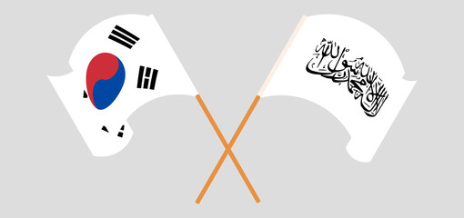 Crossed and waving flags of South Korea and Taliban
