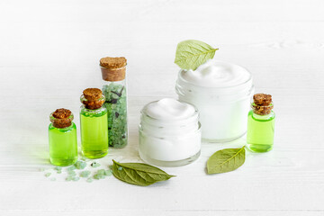 Cosmetic products with tea aroma oil and green leaves