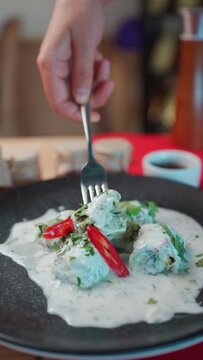 traditional georgian food gebjalia with matsoni cheese and red chili pepper