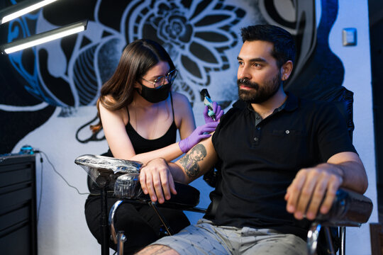 Handsome Man Getting An Arm Tattoo