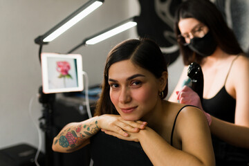 Attractive woman at the tattoo shop